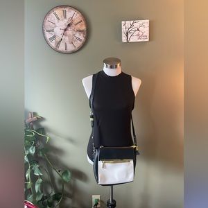 Steve Madden black and white with mustard lining and gold buttons crossbody bag